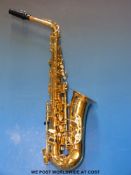A Sonata alto saxophone in brown case