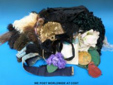 A collection of Victorian clothing, hats, feathers, clips,