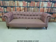 A near pair of late 19thC / 20thC Chesterfield sofas,