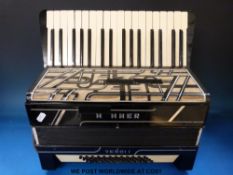 A Hohner Verdi I 48 bass piano accordion in black finish with case