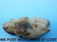 A 19thC Chinese jade carving of a courtesan with dark inclusions (6.