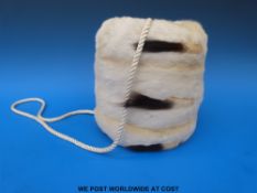 An ermine muff in original box