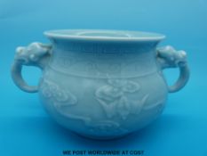 A Chinese celadon two handled censer with Qianlong mark to base (18cm diameter)