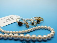 Two 9ct gold rings one set with garnets the other with a blue stone,