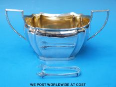 A hallmarked silver twin handled sugar bowl,