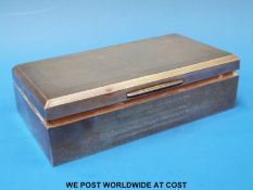 A hallmarked silver engine turned cigarette box,