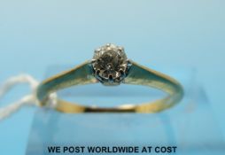 An 18ct gold ring set with a round brilliant cut diamond (size M/N)