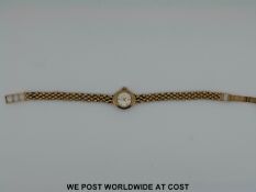 An Accurist 9ct gold ladies wristwatch and another watch