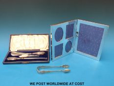 A boxed shoe horn with button hooks,