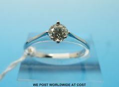 An 18ct white gold ring set with a round brilliant cut diamond measuring approximately 0.