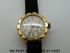 An 18ct gold watch with an enamel face