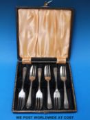 A boxed set of six  hallmarked silver cake forks (115g)