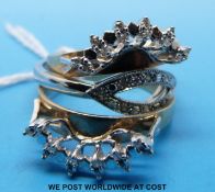 Two 9ct gold rings set with diamonds surrounding a white gold diamond set ring