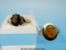Two 9ct gold rings one set with amber and the other smoky quartz
