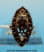 A 9ct gold ring set with garnets in a marquise-shaped setting (size M)