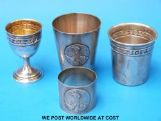 Two white metal beakers or shot glasses, both with continental silver marks,