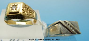 A yellow metal ring set with a diamond and a white metal ring marked 10k set with diamonds