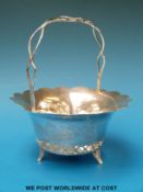 A Chinese silver pierced bon bon dish in the form of a basket with dragon decoration,