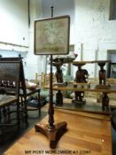 A Victorian mahogany tapestry pole screen on triform base and bun feet (height 145cm)