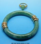 A jade bangle with 9ct gold clasps and a 9ct gold ring set with jade
