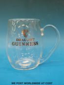 An oversized Guinness tankard,