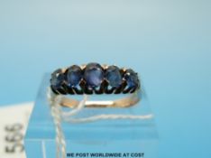 A 9ct gold ring set with five oval cut graduated sapphires (size J/K)