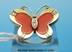 An 18ct gold ring set with coral and diamonds in the shape of a butterfly (size N)