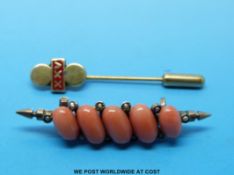 A yellow metal brooch set with coral and seed pearls and a 9ct gold stick pin