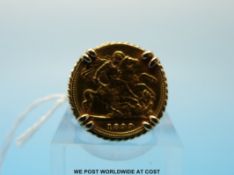 A 9ct gold ring set with an 1899 gold half sovereign (8.