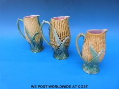 Three majolica style corn-on-the-cob jugs