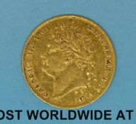 A cased 1821 George IV gold half sovereign, laureate head,