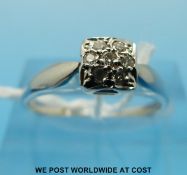 A 9ct white gold ring set with diamonds in square setting (size N)