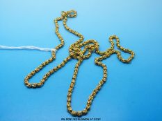 A yellow metal necklace made up of unusual knotted links (unmarked but possibly 22ct, 24.