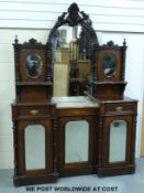 A 19thC walnut inlaid chiffonier having central arch topped mirror flanked by two oveal bevelled
