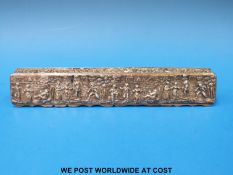 An embossed hallmarked silver box decorated with 18thC figures,