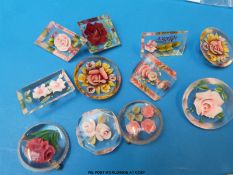 Eleven lucite brooches in various shapes of rose design