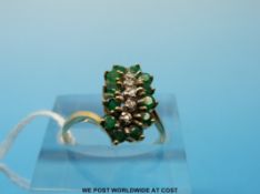 A 9ct gold ring set with emeralds and diamonds (size M)