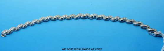 An 18ct white gold bracelet set with diamonds