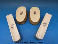 Two pairs of ivory yellow metal inlaid brushes circa early 20thC