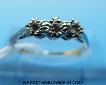 An 18ct gold ring set with diamonds in a platinum setting (size L)