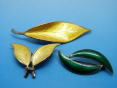 Three silver and enamel brooches in the form of leaves by David Andersen Norway