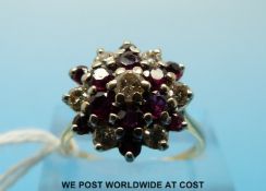 An 18ct diamond and ruby cluster ring (size P)