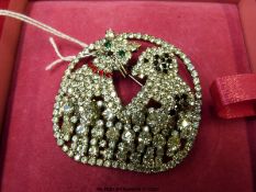 A Butler and Wilson paste brooch set with paste in the form of a dog and cat,