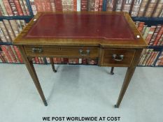 An inlaid mahogany ladies writing desk with leather inset top and two drawers,