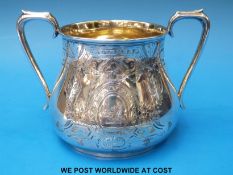 A Victorian hallmarked silver porringer or twin-handled bowl with engraved decoration and gilt wash