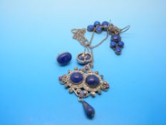 A silver pendant set with paste and Lapis Lazuli and two pairs of Lapis Lazuli earrings