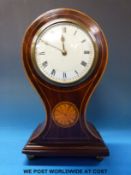 A French mantel timepiece with inlaid balloon style case