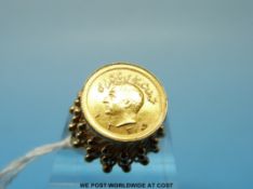 A yellow metal ring marked 18k set with gold 1/4 Pahlavi of Shah Muhammad Reza (7g)