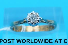 A 9ct gold ring set with a round brilliant cut diamond in an illusion setting (size L)