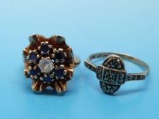A 9ct gold ring set with sapphires and a cubic zirconia together with a 9ct gold and silver ring